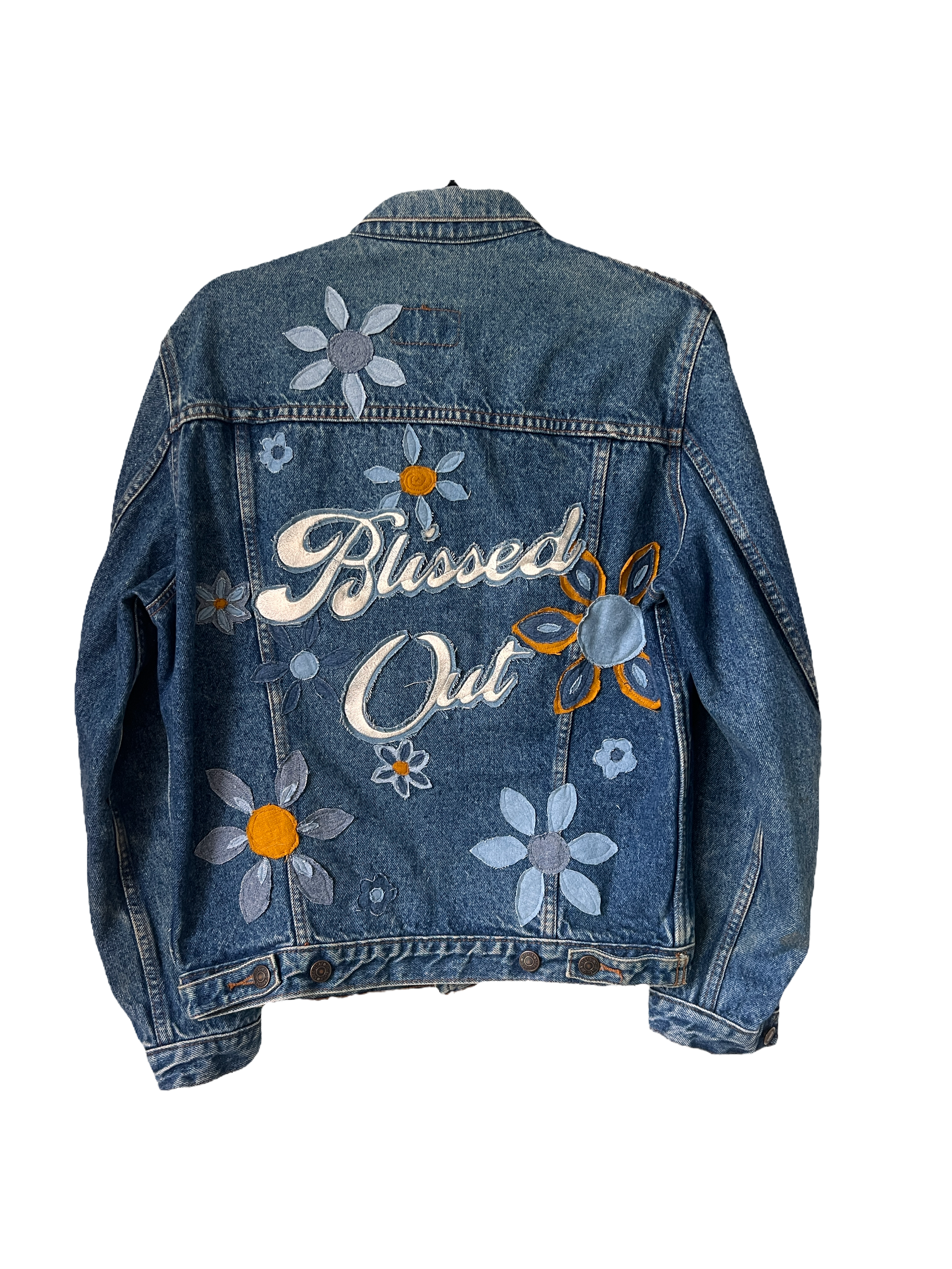 Blue denim jacket with "Blissed Out" embroidered back design and floral embroidery, shown from the back.