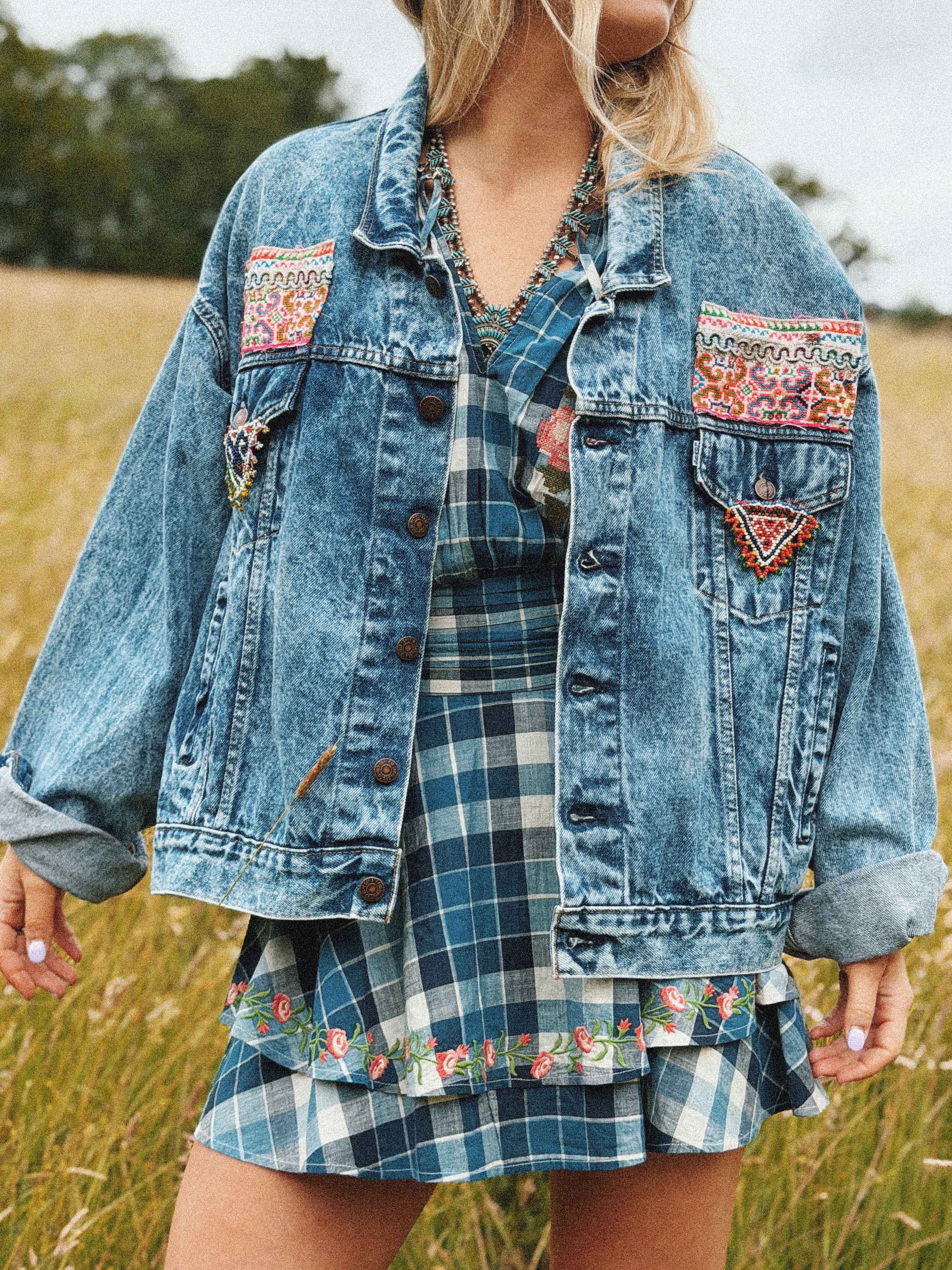 Bohemian-style blue denim jacket with colourful embroidered front detail, shown from the front