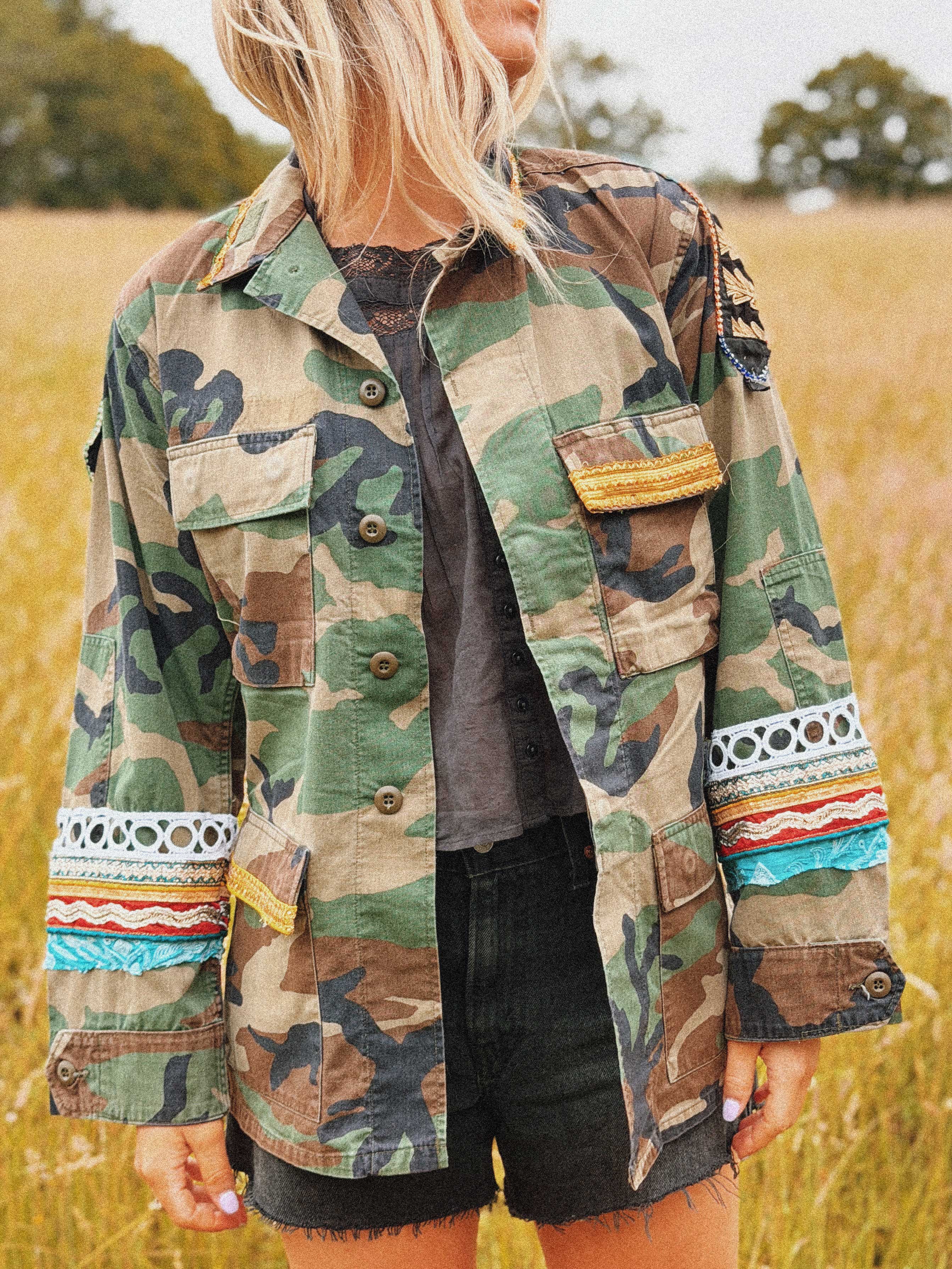 Camouflage jacket with colourful embroidered and embellished trim, shown from the front