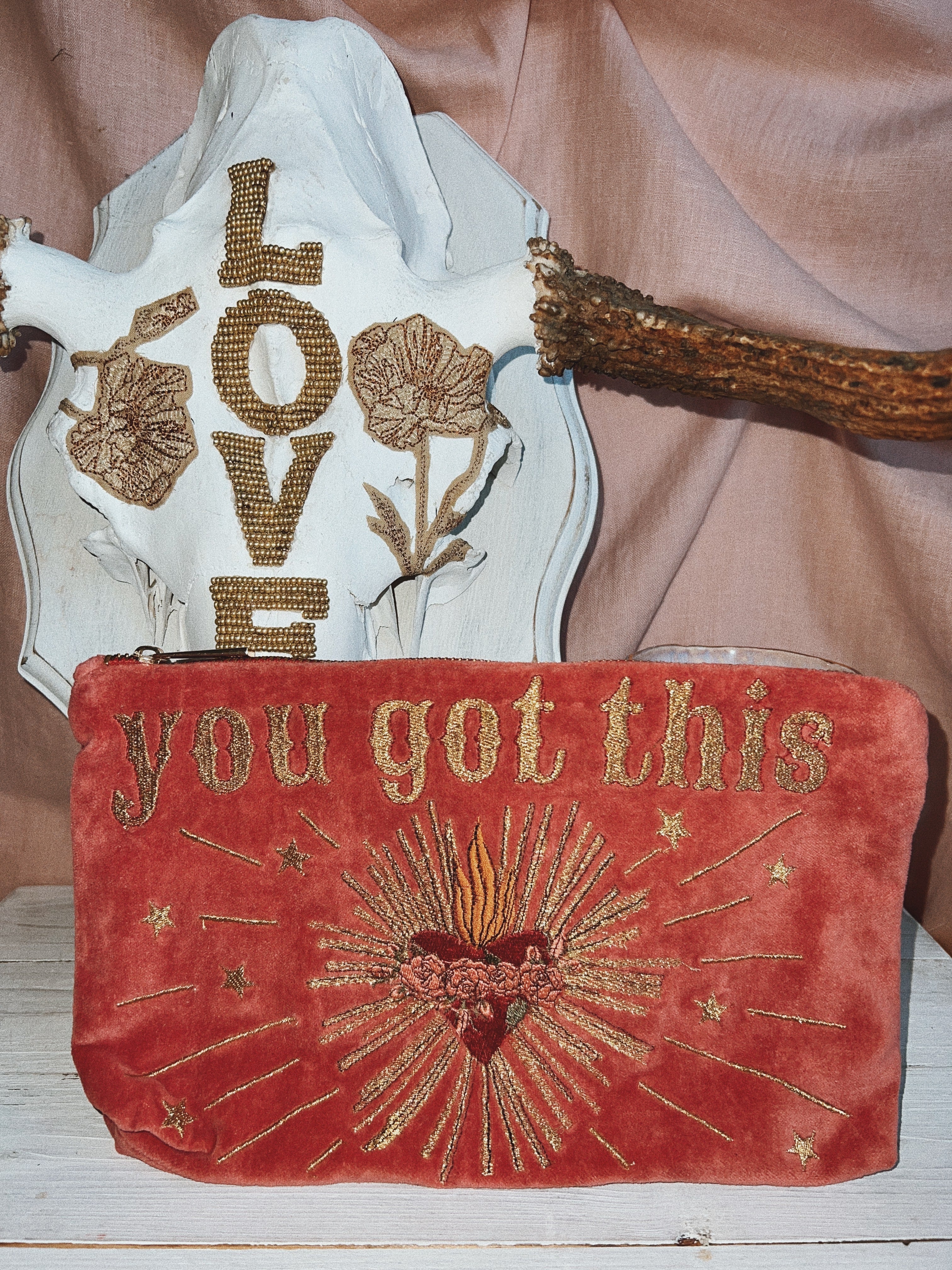 Rich pink velvet zip pouch embroidered with the phrase "you got this" and a radiant sacred heart design.